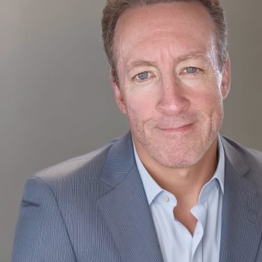 Picture of white male in grey suit
